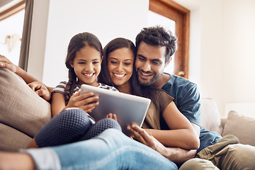 Image showing Happy family, people with tablet on sofa bonding and in living room in their home. Love or care, communication with technology and social media or movie streaming with mobile device on couch