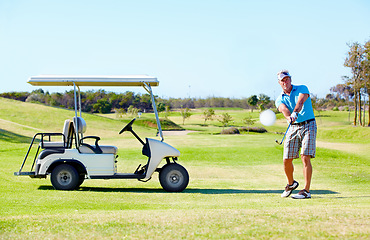 Image showing Sports, relax and swing with man on golf course with cart for hobby, training and competition. Game, action and fitness with male golfer and stroke on grass field for golfing, summer and recreation