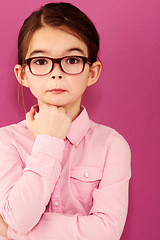 Image showing Girl child in portrait, glasses and thinking with questioning expression, smart and vision isolated on pink background. Intelligent, geek or nerd with female kid in studio, thoughtful in eyewear