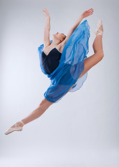 Image showing Woman, ballet dancing and studio with jump in air, art movement and beauty for training. Professional dancer, dance performance and finesse in class with strong body, wellness and freedom at concert