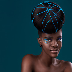 Image showing Thinking, hair and mockup with a model black woman in studio on a blue background for beauty. Idea, space and cosmetics with an attractive young female person at the salon for fashion or makeup