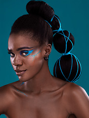 Image showing Portrait, hair and makeup with an african woman model in studio on a blue background for haircare or fashion. Face, cosmetics and style with an attractive young female person posing for haircare