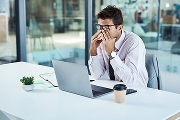 Image showing Stress, laptop and man with headache in office frustrated with glitch, mistake or crisis. Anxiety, migraine and male business person angry with fail, 404 or bad review, deadline report or burnout