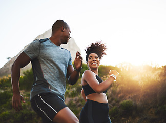 Image showing Fitness, energy and athletes running in nature by a mountain training for race, marathon or competition. Sports, health and African couple doing outdoor cardio workout or exercise together at sunset.