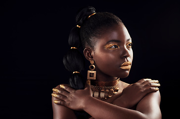 Image showing Glitter, makeup and black woman in studio for beauty, luxury and skincare on black background, Gold, art and African female model with wealth, glow and jewellery, elegance and posing royal aesthetic