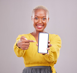 Image showing Phone screen, mockup and portrait of woman isolated on studio background, mobile app and advertising space. African person or online user point to cellphone mock up for website, contact or ux design