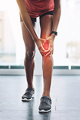 Image showing Hands, pain and knee injury with a woman in studio holding an injury to her joint while training for fitness. Accident, emergency and anatomy with a female athlete suffering from muscle inflammation