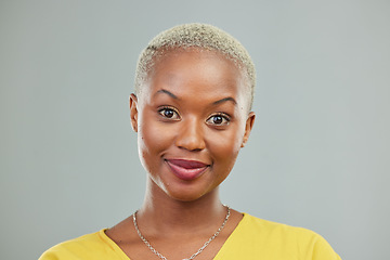 Image showing Happy, portrait and woman in studio with confidence, cool and edgy against a grey or wall background. Headshot, face and young african female model smile, cheerful and proud, satisfied and beautiful