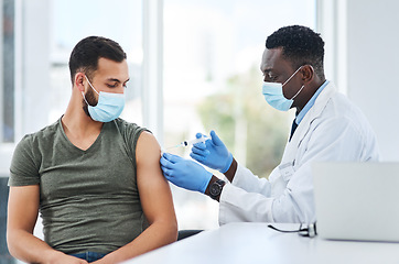 Image showing Covid, vaccine and man doctor with syringe in healthcare consultation for safety or prevention. Corona, vaccination and arm injection for guy person by physician in face mask for hospital compliance