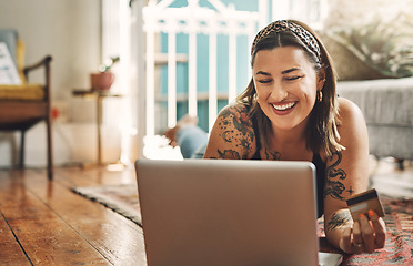 Image showing Laptop, credit card and woman on floor in online shopping, e commerce and fintech, home payment or finance. Happy person relax on carpet, banking or website sale, discount or subscription on computer