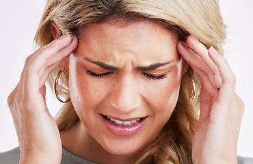 Image showing Burnout, stress and woman with a headache, emergency and exhausted with pain, overworked or depression. Female person, face or model with a migraine, fatigue or frustrated against a studio background