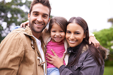 Image showing Family, hug and park portrait with a mom, dad and girl together with happiness and smile. Outdoor, face and summer vacation of a mother, father and young kid with bonding, parent love and child care