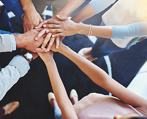 Image showing Business people, hands together and office worker group with support, motivation and solidarity gesture. Above, hand in and success of teamwork and staff with workplace community and achievement