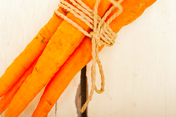 Image showing baby carrots bunch tied with rope