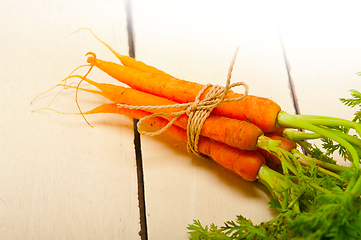 Image showing baby carrots bunch tied with rope