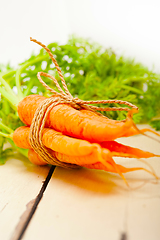 Image showing baby carrots bunch tied with rope