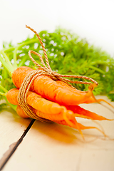 Image showing baby carrots bunch tied with rope