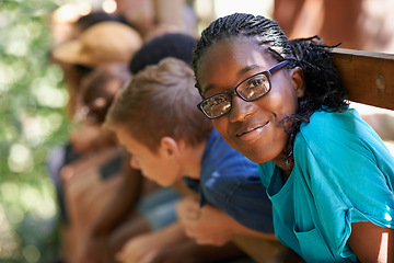 Image showing Black girl, camp or friends portrait with happiness or glasses outdoor. Happy, African and female teen with face and a smile from summer camping, holiday or team building with fun people in treehouse