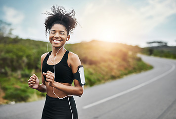 Image showing Exercise, portrait and happy woman runner on a road with music for fitness, workout or cardio. Smile, sports and African female running in nature with podcast for training, motivation or performance