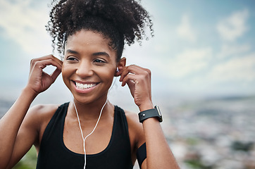 Image showing Music, fitness and happy woman runner outdoors for wellness, training and cardio. Radio, smile and african female runner with podcast for workout motivation, exercise and sports, routine and run