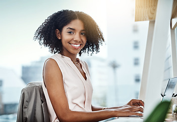 Image showing Typing, computer and portrait of woman in office planning, online management and productivity for business mindset. Face of a happy professional worker, employee or African person working on desktop