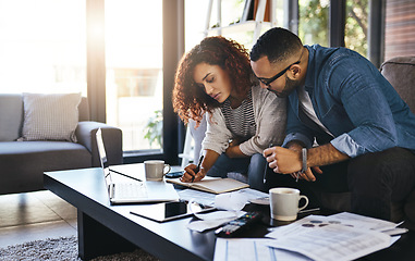 Image showing Couple planning budget, finance and bills with notes to pay for loan, mortgage and debt in living room. Financial review of spending for home, income and savings, man and woman writing in notebook