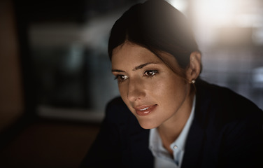 Image showing Thinking, overtime and woman in modern office reading email or problem solving proposal at startup agency. Corporate night work, ideas and time management, business employee working on online report.