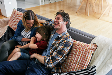 Image showing Parents, family and child laughing for tickles on sofa in lounge with love, care and quality time to relax together. Happy boy playing funny game with mother, father and comedy in living room at home