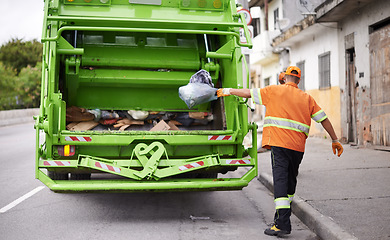 Image showing Waste, truck and man with garbage, collection and recycling in the community, city and clean. Back, male employee and trash collector with vehicle, street and service with rubbish and sanitation