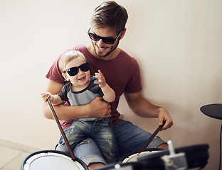 Image showing Father, baby and child drum lesson with music development and learning. Home, happiness and bonding with youth drumming teaching with a smile, love and happy parent care together at a family house