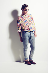 Image showing Fashion, unique and funky with a hipster man in studio on a white background for contemporary style. Trendy, cool and edgy with a handsome young male model posing in stylish or fashionable clothes