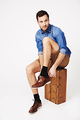 Image showing Fashion, man and shoes in studio against white background for morning routine or dressing. Shoe, choice and casual male with outfit for style, decision and fashionable or trendy clothing aesthetic