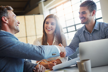 Image showing Handshake, meeting and collaboration with business people in the office, in agreement of a deal or negotiation. Teamwork, thank you and professional men shaking hands in a corporate boardroom