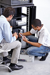 Image showing Server room, man or electrician with working electronics for hardware maintenance or fixing glitch in office. IT support or worker with a technician or electrical engineer for information technology