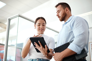 Image showing Tablet, partner and happy business people reading, advice or feedback of digital proposal and planning in office. Asian woman with man or manager on digital technology for startup and research check