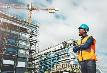 Image showing Engineer, construction and a man thinking of development at building site with architecture. Black male contractor happy about project management, engineering and safety inspection outdoor in city