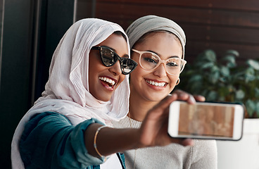 Image showing Selfie, muslim people and friends with sunglasses in city for social media, influencer content creation or fashion blog. Happy gen z women in Saudi Arabia, emoji profile picture or online photography