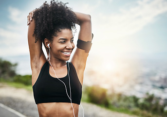 Image showing Smile, woman and stretching arms for running outdoors with music for fitness, workout or cardio routine. Stretch, exercise and happy African female runner in nature with podcast for training run