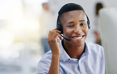 Image showing Virtual assistant, portrait or friendly black man in call center consulting or talking at customer services. Communication, happy smile or face of sales agent on mic in telemarketing or telecom desk