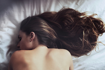 Image showing Sleeping, back and woman in bed resting, dreaming and peaceful, nap and comfort from above. Bedroom, sleep and tired girl enjoying rest in her home, content and calm, quiet and tranquil on weekend