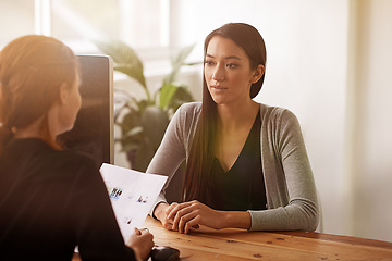 Image showing Interview, discussion and business women in office in conversation, talking and planning at desk. Communication, partnership and female workers with document for recruitment, hiring and collaboration