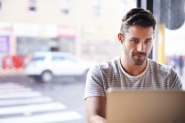 Image showing Entrepreneur, laptop or man in cafe reading news online the stock market for trading report update. Coffee shop, remote work or trader typing an email or networking on internet or digital website