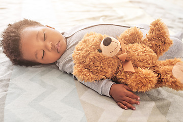 Image showing Sleeping, teddy bear and newborn with baby in bedroom for comfort, development and innocence. Dreaming, relax and comfortable with tired African infant and toy at home for morning, rest and bedtime