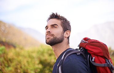 Image showing Hiking, relax and thinking with man on mountain for fitness, adventure and travel journey. Backpack, summer and workout with male hiker trekking in nature path for training, freedom and explore