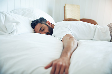 Image showing Tired, dream and a man on a bed for sleep, relax and fatigue at home. Rest, napping and a guy sleeping in the bedroom with insomnia, narcolepsy or content while lying down and dreaming in the morning