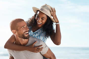 Image showing Love, beach and piggy back, happy couple with blue sky on romantic summer holiday travel to ocean. Romance, man and woman have fun at sea, happiness on honeymoon and vacation time together in Mexico.