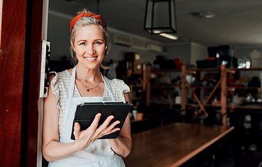 Image showing Happy woman, portrait smile and tablet in small business confidence at entrance for workshop in retail store. Confident female person, ceramic designer or owner with technology for creative startup