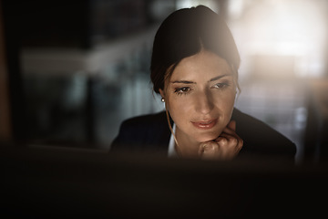 Image showing Thinking, overtime and business woman in modern office reading email, proposal or problem solving at start up. Night work, ideas and time management, corporate worker at desk working on online report