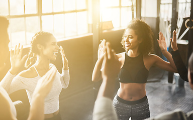 Image showing Funny, high five and teamwork of people in gym for fitness, team building and solidarity. Collaboration, group of friends and celebration for exercise targets, goals or support, success or lens flare