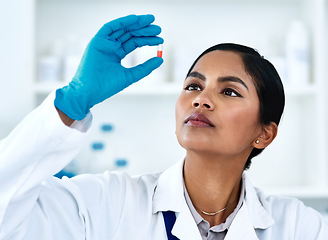 Image showing Woman, pills and medical science research or scientist development for future drugs, medicine or product. Face of female worker in laboratory for pharmaceutical discovery, innovation and analysis